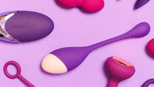 Purple and pink silicone vibrators on lavender background, premium adult toys for intimate pleasure.